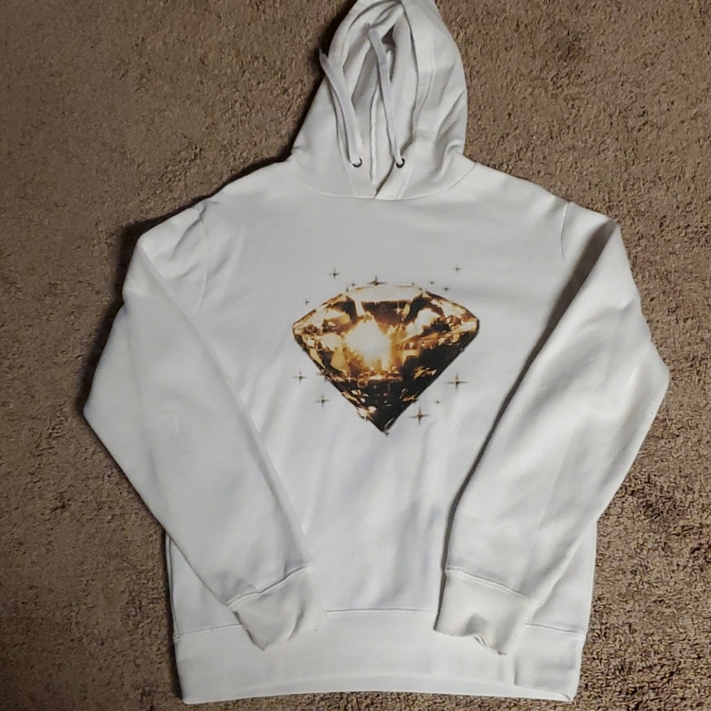 White hoodie with huge yellow diamond graphic.